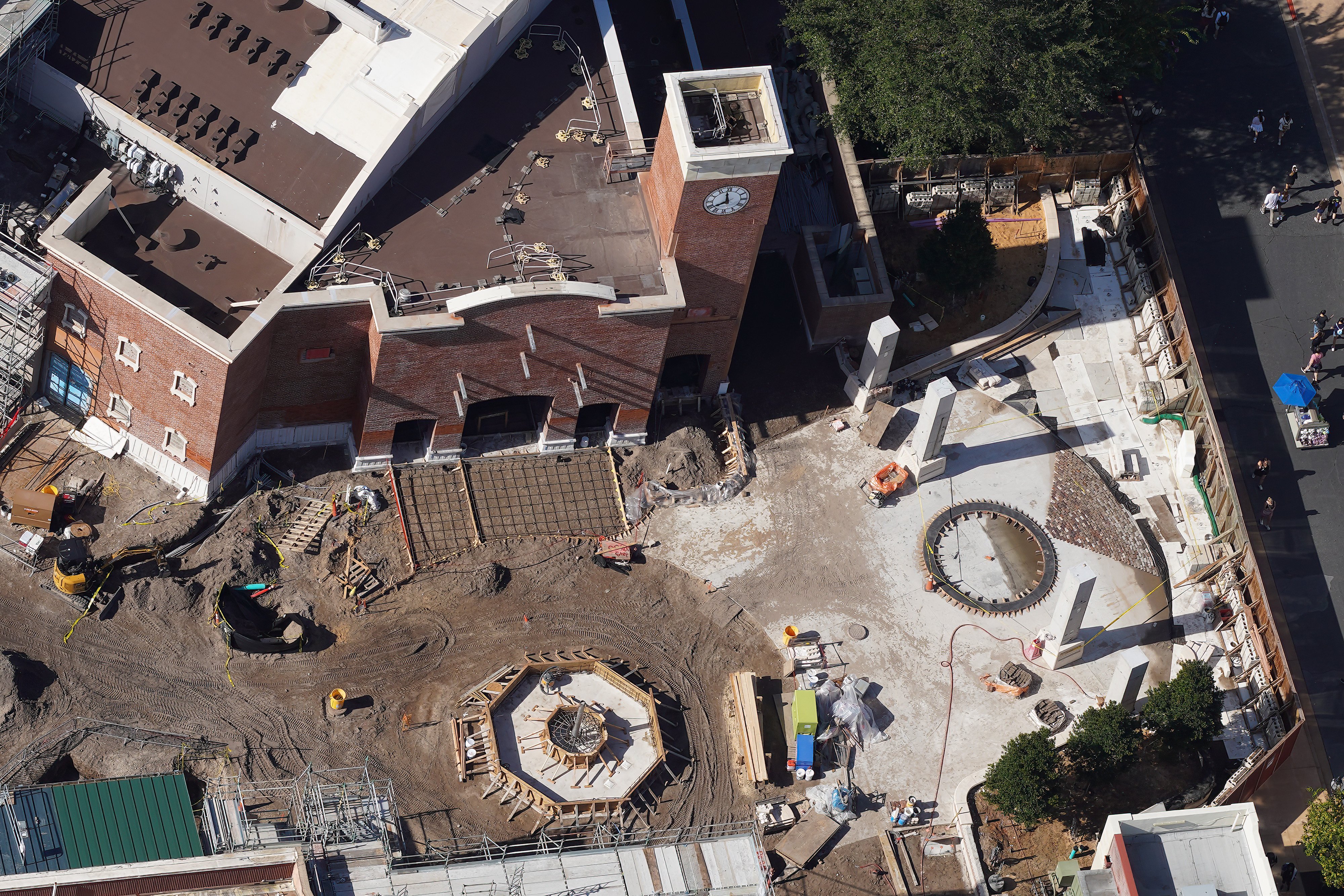 Aerial view of Monstropolis fountain formwork, theater building, and surrounding hardscape at Hollywood Studios