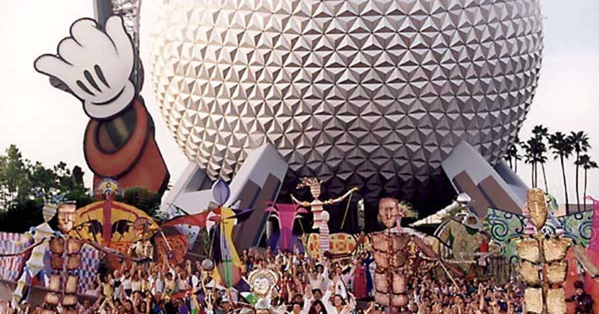 Cast pose infront of the new Epcot icon