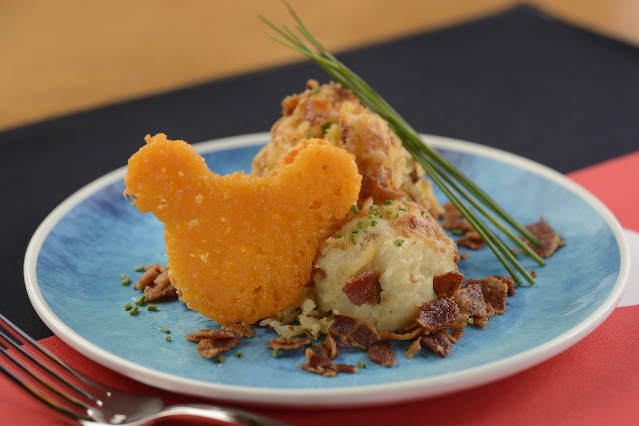 “Loaded” Potato-Cheese Casserole topped with smoked bacon crumbles and chives