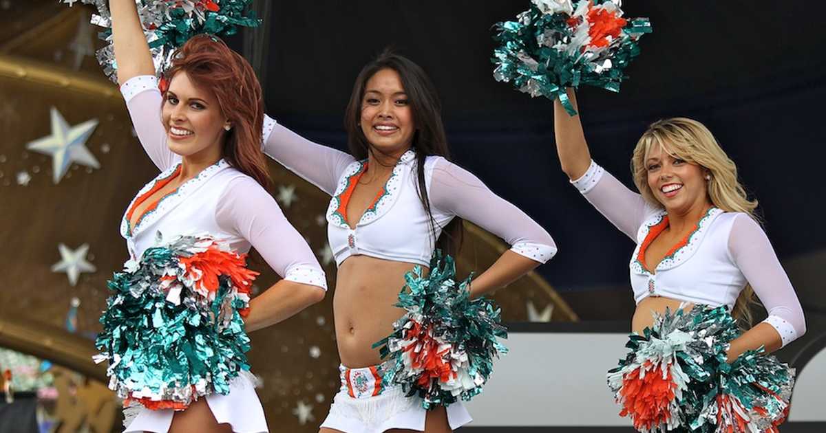 Miami Dolphins cheerleaders dance and perform with their pom poms