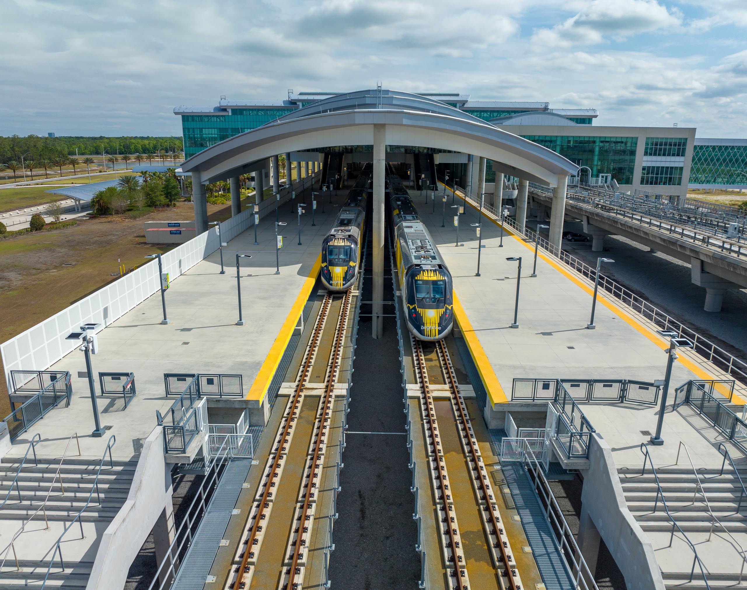 Brightline train beside the platform at Orlando International Airport